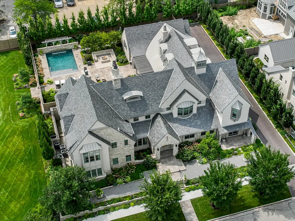222 West Van Buren Avenue Home in Naperville, Illinois. Experience the epitome of luxury living at the Laurel Estate, a stunning French provincial-style mansion meticulously crafted by Charles Cook Architectural Design Studio. This flagship Midwest estate offers a unique blend of elegant design, spa-like ambiance, and seamless indoor-outdoor spaces. 