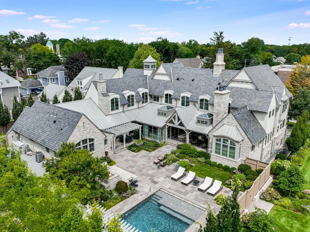 222 West Van Buren Avenue Home in Naperville, Illinois. Experience the epitome of luxury living at the Laurel Estate, a stunning French provincial-style mansion meticulously crafted by Charles Cook Architectural Design Studio. This flagship Midwest estate offers a unique blend of elegant design, spa-like ambiance, and seamless indoor-outdoor spaces. 