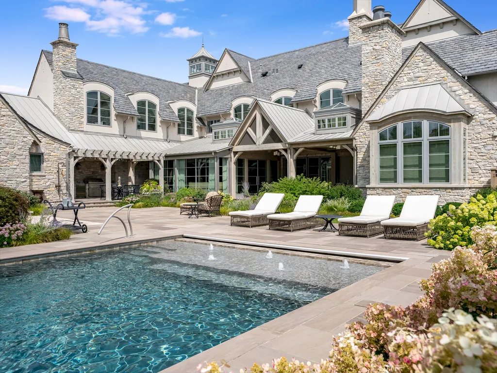 222 West Van Buren Avenue Home in Naperville, Illinois. Experience the epitome of luxury living at the Laurel Estate, a stunning French provincial-style mansion meticulously crafted by Charles Cook Architectural Design Studio. This flagship Midwest estate offers a unique blend of elegant design, spa-like ambiance, and seamless indoor-outdoor spaces. 
