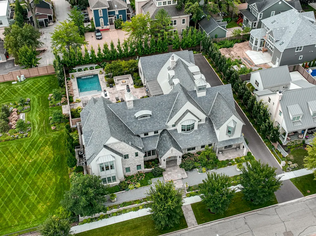 222 West Van Buren Avenue Home in Naperville, Illinois. Experience the epitome of luxury living at the Laurel Estate, a stunning French provincial-style mansion meticulously crafted by Charles Cook Architectural Design Studio. This flagship Midwest estate offers a unique blend of elegant design, spa-like ambiance, and seamless indoor-outdoor spaces. 