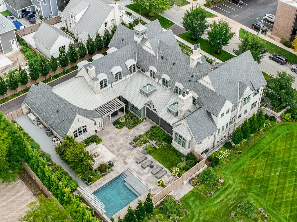 222 West Van Buren Avenue Home in Naperville, Illinois. Experience the epitome of luxury living at the Laurel Estate, a stunning French provincial-style mansion meticulously crafted by Charles Cook Architectural Design Studio. This flagship Midwest estate offers a unique blend of elegant design, spa-like ambiance, and seamless indoor-outdoor spaces. 