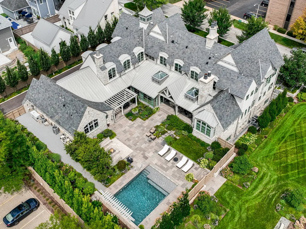 222 West Van Buren Avenue Home in Naperville, Illinois. Experience the epitome of luxury living at the Laurel Estate, a stunning French provincial-style mansion meticulously crafted by Charles Cook Architectural Design Studio. This flagship Midwest estate offers a unique blend of elegant design, spa-like ambiance, and seamless indoor-outdoor spaces. 