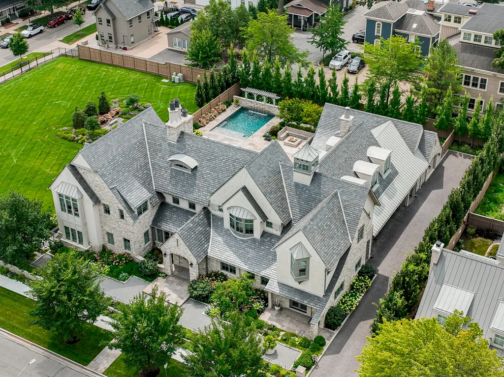 222 West Van Buren Avenue Home in Naperville, Illinois. Experience the epitome of luxury living at the Laurel Estate, a stunning French provincial-style mansion meticulously crafted by Charles Cook Architectural Design Studio. This flagship Midwest estate offers a unique blend of elegant design, spa-like ambiance, and seamless indoor-outdoor spaces. 