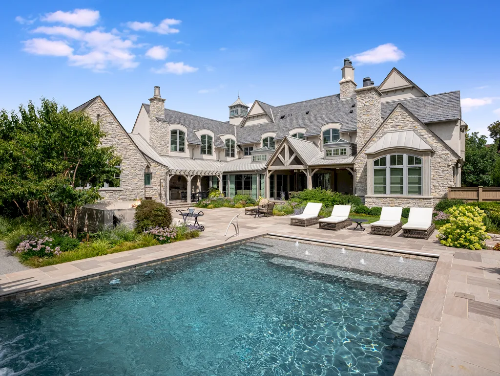222 West Van Buren Avenue Home in Naperville, Illinois. Experience the epitome of luxury living at the Laurel Estate, a stunning French provincial-style mansion meticulously crafted by Charles Cook Architectural Design Studio. This flagship Midwest estate offers a unique blend of elegant design, spa-like ambiance, and seamless indoor-outdoor spaces. 