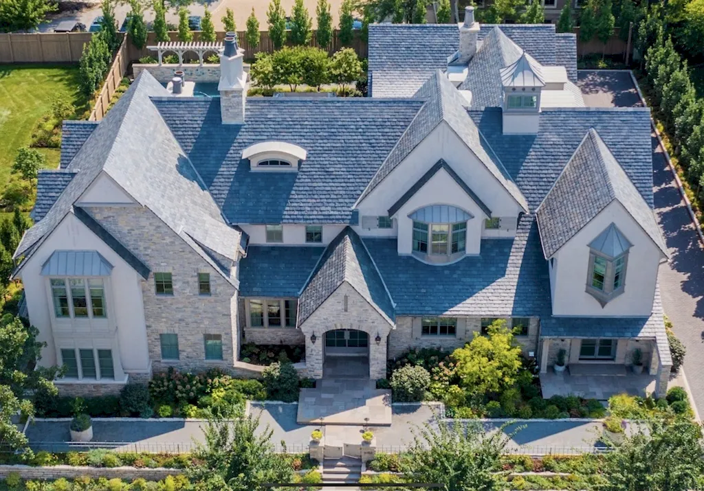 222 West Van Buren Avenue Home in Naperville, Illinois. Experience the epitome of luxury living at the Laurel Estate, a stunning French provincial-style mansion meticulously crafted by Charles Cook Architectural Design Studio. This flagship Midwest estate offers a unique blend of elegant design, spa-like ambiance, and seamless indoor-outdoor spaces. 