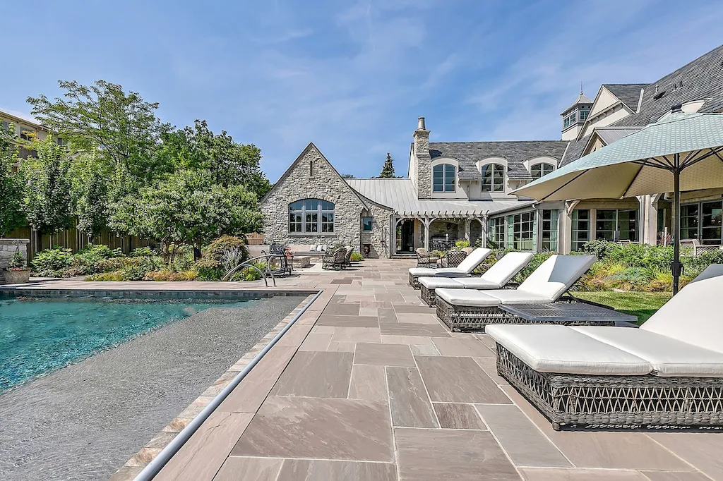 222 West Van Buren Avenue Home in Naperville, Illinois. Experience the epitome of luxury living at the Laurel Estate, a stunning French provincial-style mansion meticulously crafted by Charles Cook Architectural Design Studio. This flagship Midwest estate offers a unique blend of elegant design, spa-like ambiance, and seamless indoor-outdoor spaces. 