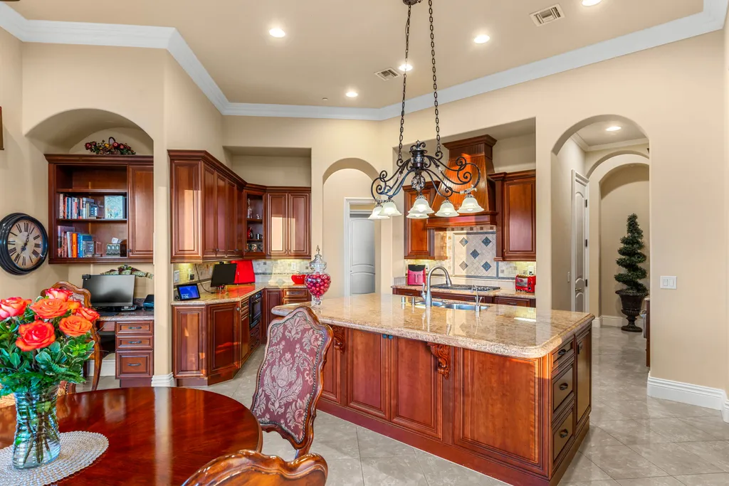 232 Valare Street Home in Henderson, Nevada. Discover the epitome of luxury living in this custom-built split-level home in Las Vegas. With stunning city views, lavish amenities, and meticulous attention to detail, this residence offers the ultimate in upscale living. From the private gated entrance to the infinity pool and spa overlooking the city, this Las Vegas dream home redefines luxury living.
