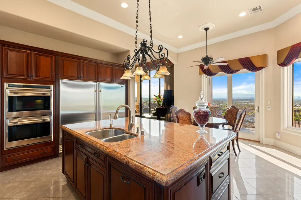 232 Valare Street Home in Henderson, Nevada. Discover the epitome of luxury living in this custom-built split-level home in Las Vegas. With stunning city views, lavish amenities, and meticulous attention to detail, this residence offers the ultimate in upscale living. From the private gated entrance to the infinity pool and spa overlooking the city, this Las Vegas dream home redefines luxury living.