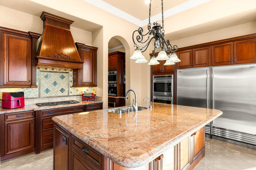 232 Valare Street Home in Henderson, Nevada. Discover the epitome of luxury living in this custom-built split-level home in Las Vegas. With stunning city views, lavish amenities, and meticulous attention to detail, this residence offers the ultimate in upscale living. From the private gated entrance to the infinity pool and spa overlooking the city, this Las Vegas dream home redefines luxury living.