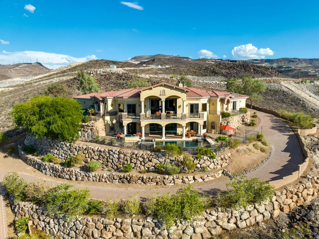 232 Valare Street Home in Henderson, Nevada. Discover the epitome of luxury living in this custom-built split-level home in Las Vegas. With stunning city views, lavish amenities, and meticulous attention to detail, this residence offers the ultimate in upscale living. From the private gated entrance to the infinity pool and spa overlooking the city, this Las Vegas dream home redefines luxury living.
