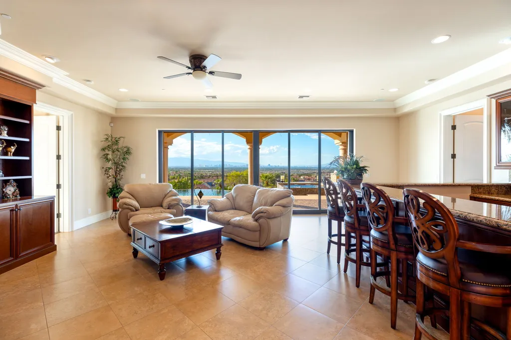 232 Valare Street Home in Henderson, Nevada. Discover the epitome of luxury living in this custom-built split-level home in Las Vegas. With stunning city views, lavish amenities, and meticulous attention to detail, this residence offers the ultimate in upscale living. From the private gated entrance to the infinity pool and spa overlooking the city, this Las Vegas dream home redefines luxury living.