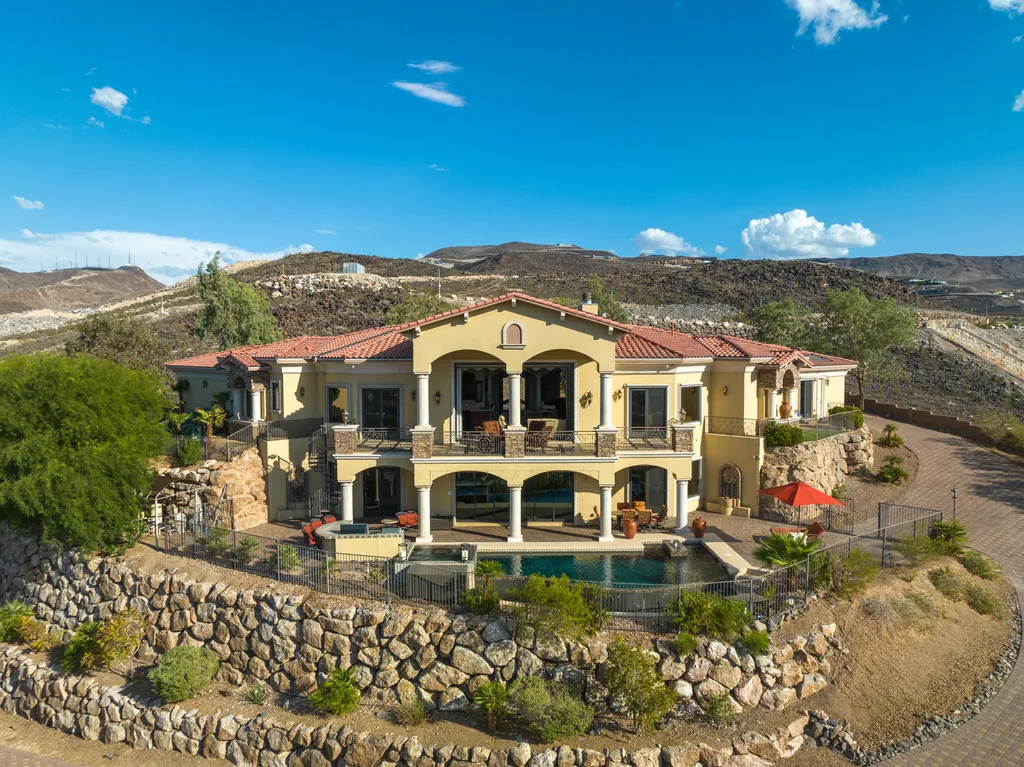 232 Valare Street Home in Henderson, Nevada. Discover the epitome of luxury living in this custom-built split-level home in Las Vegas. With stunning city views, lavish amenities, and meticulous attention to detail, this residence offers the ultimate in upscale living. From the private gated entrance to the infinity pool and spa overlooking the city, this Las Vegas dream home redefines luxury living.