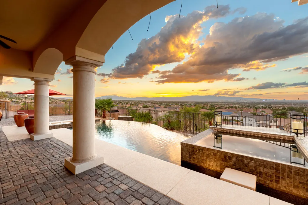 232 Valare Street Home in Henderson, Nevada. Discover the epitome of luxury living in this custom-built split-level home in Las Vegas. With stunning city views, lavish amenities, and meticulous attention to detail, this residence offers the ultimate in upscale living. From the private gated entrance to the infinity pool and spa overlooking the city, this Las Vegas dream home redefines luxury living.