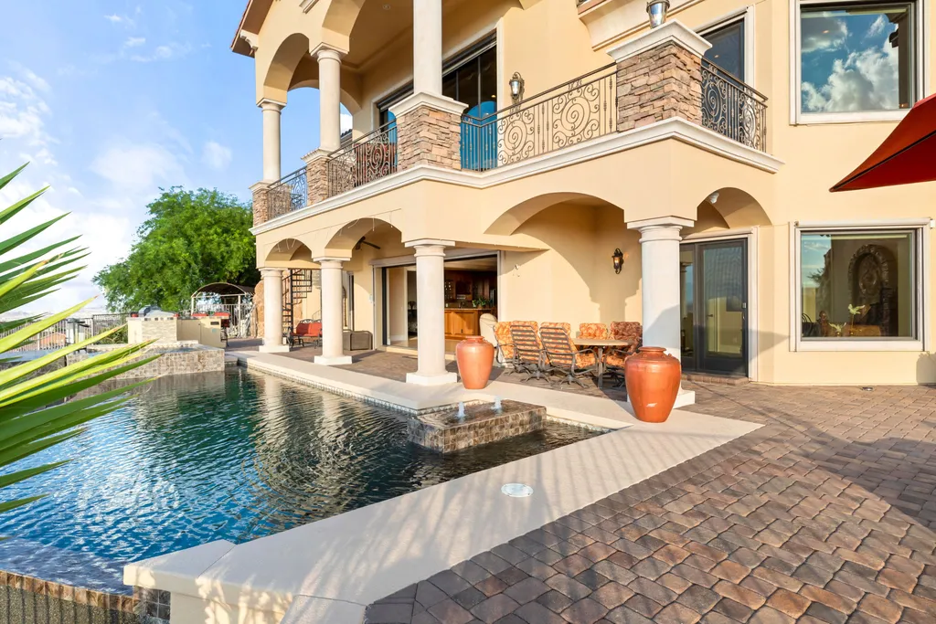 232 Valare Street Home in Henderson, Nevada. Discover the epitome of luxury living in this custom-built split-level home in Las Vegas. With stunning city views, lavish amenities, and meticulous attention to detail, this residence offers the ultimate in upscale living. From the private gated entrance to the infinity pool and spa overlooking the city, this Las Vegas dream home redefines luxury living.
