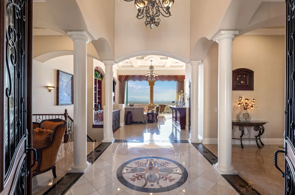 232 Valare Street Home in Henderson, Nevada. Discover the epitome of luxury living in this custom-built split-level home in Las Vegas. With stunning city views, lavish amenities, and meticulous attention to detail, this residence offers the ultimate in upscale living. From the private gated entrance to the infinity pool and spa overlooking the city, this Las Vegas dream home redefines luxury living.
