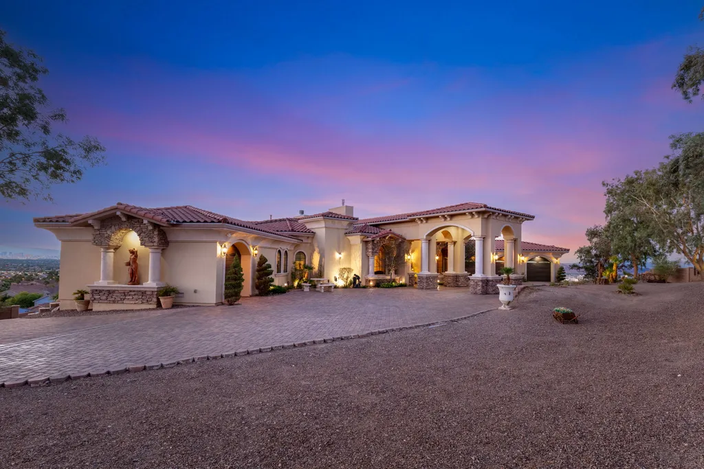 232 Valare Street Home in Henderson, Nevada. Discover the epitome of luxury living in this custom-built split-level home in Las Vegas. With stunning city views, lavish amenities, and meticulous attention to detail, this residence offers the ultimate in upscale living. From the private gated entrance to the infinity pool and spa overlooking the city, this Las Vegas dream home redefines luxury living.