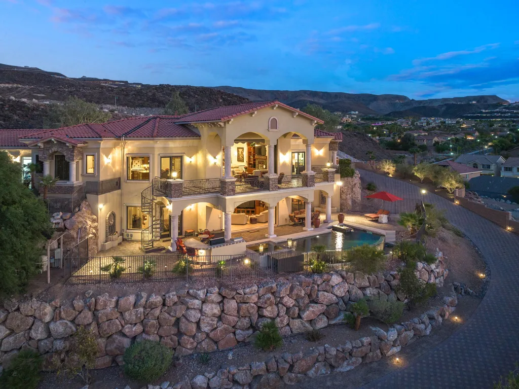 232 Valare Street Home in Henderson, Nevada. Discover the epitome of luxury living in this custom-built split-level home in Las Vegas. With stunning city views, lavish amenities, and meticulous attention to detail, this residence offers the ultimate in upscale living. From the private gated entrance to the infinity pool and spa overlooking the city, this Las Vegas dream home redefines luxury living.