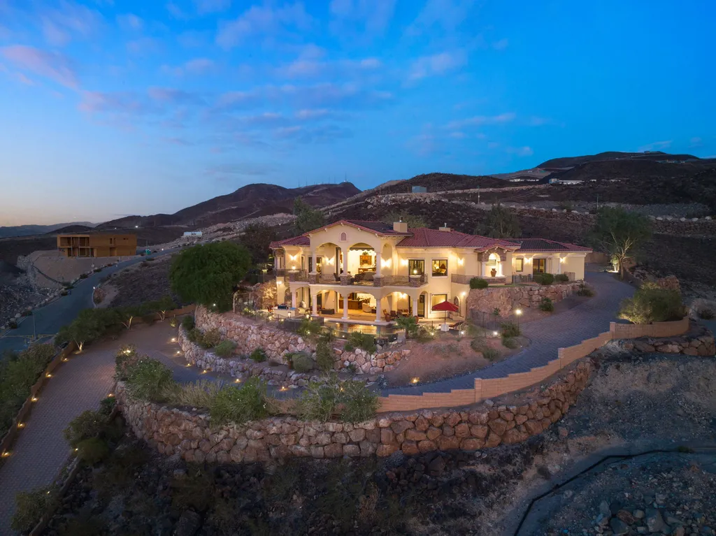 232 Valare Street Home in Henderson, Nevada. Discover the epitome of luxury living in this custom-built split-level home in Las Vegas. With stunning city views, lavish amenities, and meticulous attention to detail, this residence offers the ultimate in upscale living. From the private gated entrance to the infinity pool and spa overlooking the city, this Las Vegas dream home redefines luxury living.