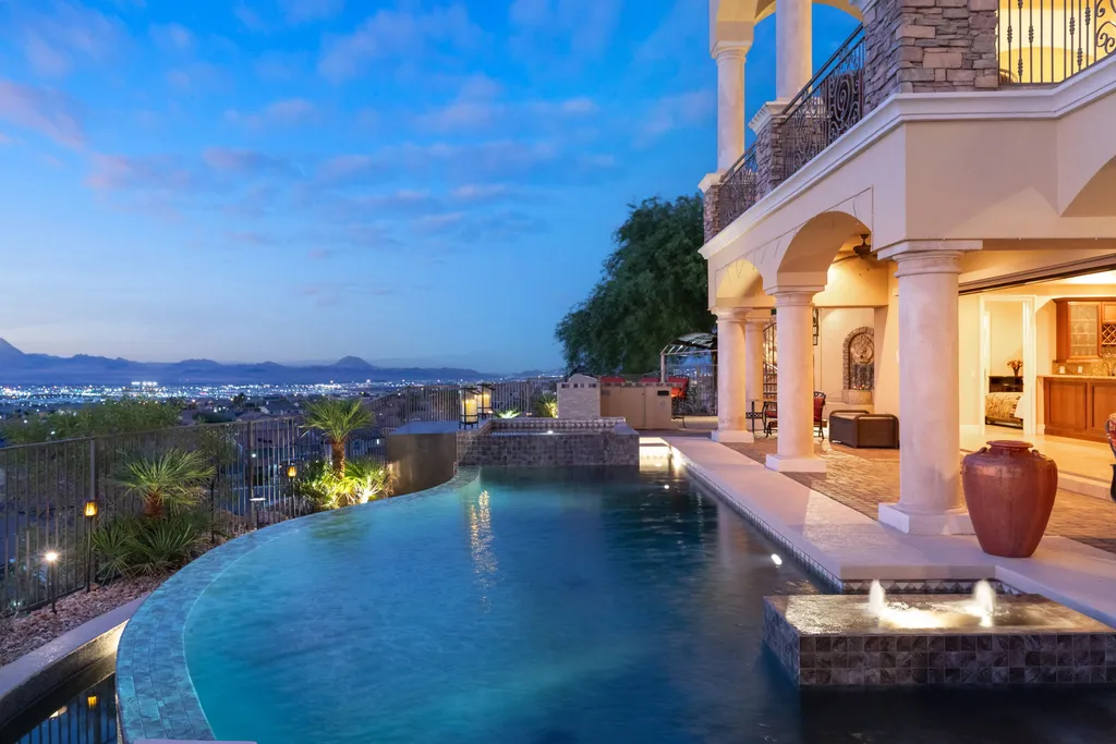 232 Valare Street Home in Henderson, Nevada. Discover the epitome of luxury living in this custom-built split-level home in Las Vegas. With stunning city views, lavish amenities, and meticulous attention to detail, this residence offers the ultimate in upscale living. From the private gated entrance to the infinity pool and spa overlooking the city, this Las Vegas dream home redefines luxury living.