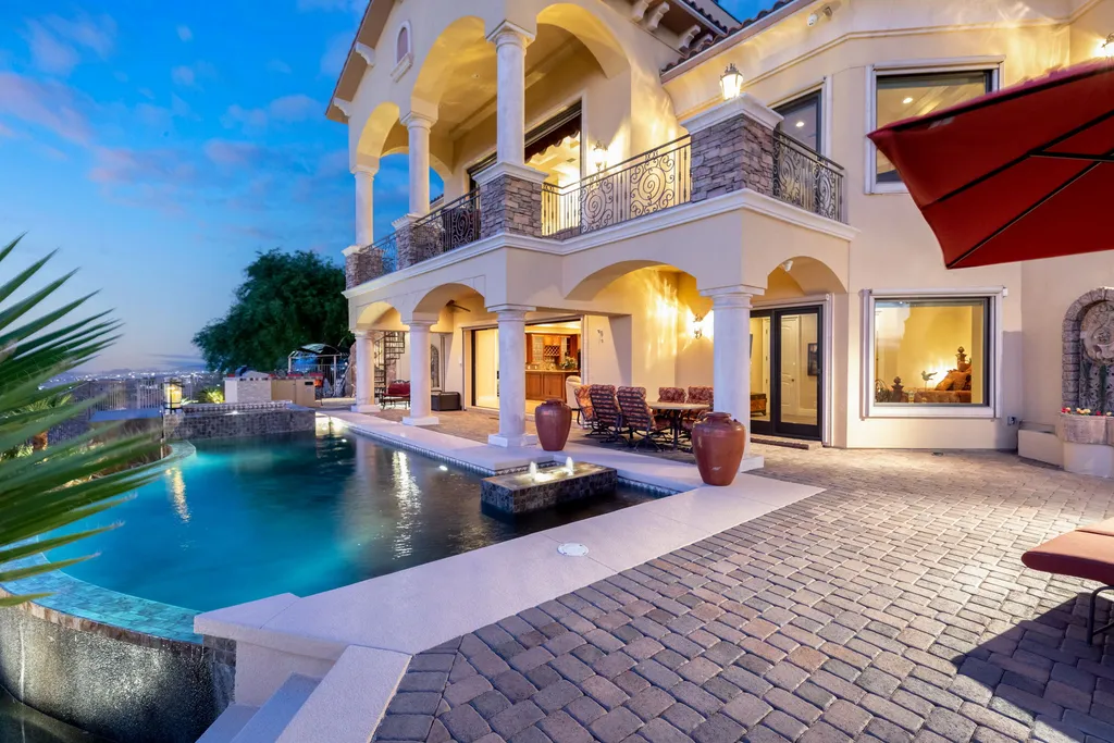 232 Valare Street Home in Henderson, Nevada. Discover the epitome of luxury living in this custom-built split-level home in Las Vegas. With stunning city views, lavish amenities, and meticulous attention to detail, this residence offers the ultimate in upscale living. From the private gated entrance to the infinity pool and spa overlooking the city, this Las Vegas dream home redefines luxury living.