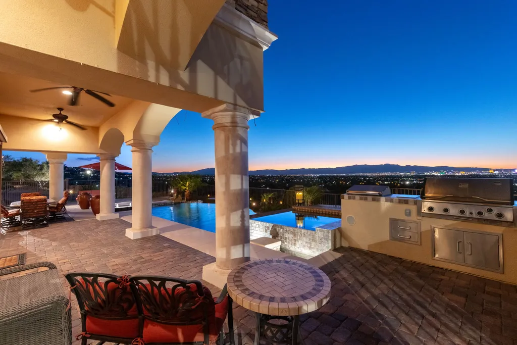 232 Valare Street Home in Henderson, Nevada. Discover the epitome of luxury living in this custom-built split-level home in Las Vegas. With stunning city views, lavish amenities, and meticulous attention to detail, this residence offers the ultimate in upscale living. From the private gated entrance to the infinity pool and spa overlooking the city, this Las Vegas dream home redefines luxury living.