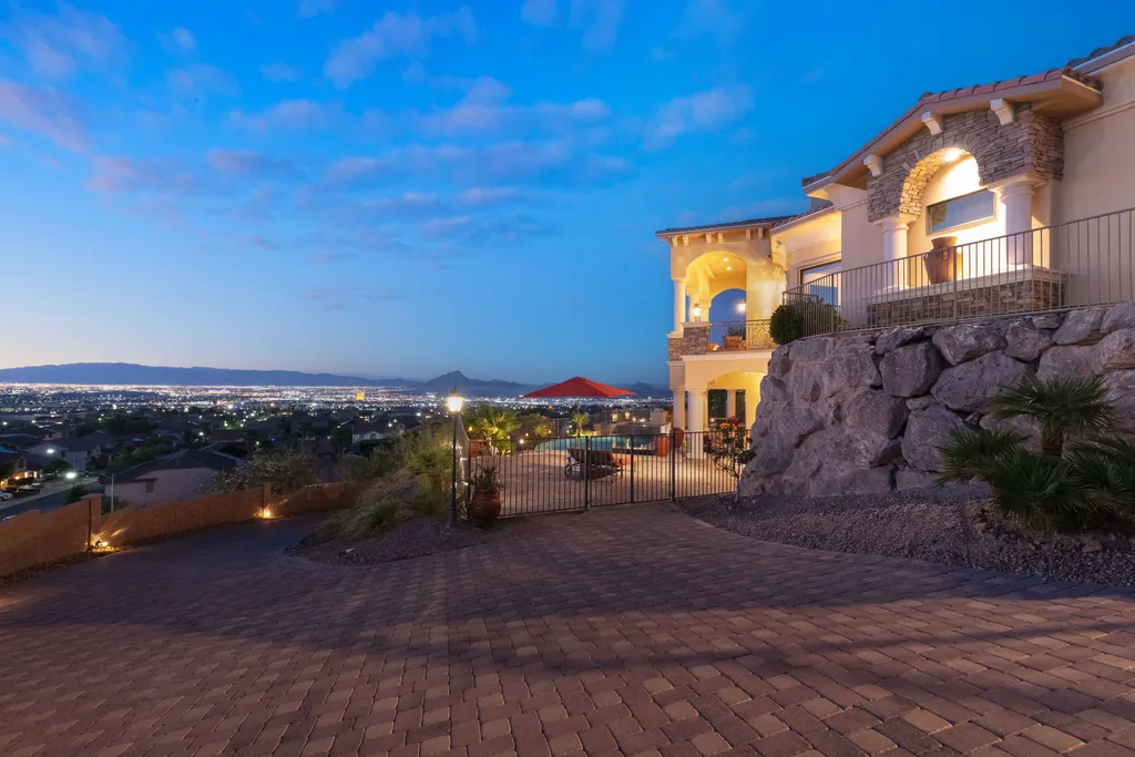 232 Valare Street Home in Henderson, Nevada. Discover the epitome of luxury living in this custom-built split-level home in Las Vegas. With stunning city views, lavish amenities, and meticulous attention to detail, this residence offers the ultimate in upscale living. From the private gated entrance to the infinity pool and spa overlooking the city, this Las Vegas dream home redefines luxury living.