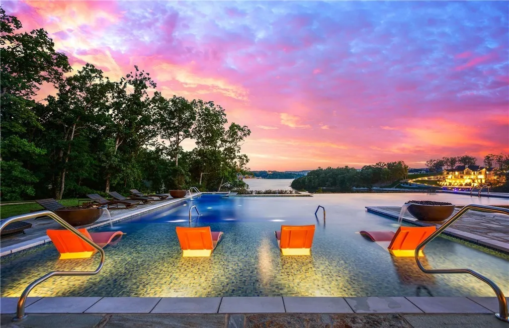 25 Springridge Lane Home in Sunrise Beach, Missouri. Experience the epitome of luxury at The Villages at Shawnee Bend, Lake of the Ozarks' most exclusive home development. This stunning estate, located in Billionaire’s Cove, is a one-of-a-kind masterpiece. Set on over 13 acres with 600+ feet of shoreline, it offers panoramic main channel views while nestled in a deepwater cove for dock protection and privacy.