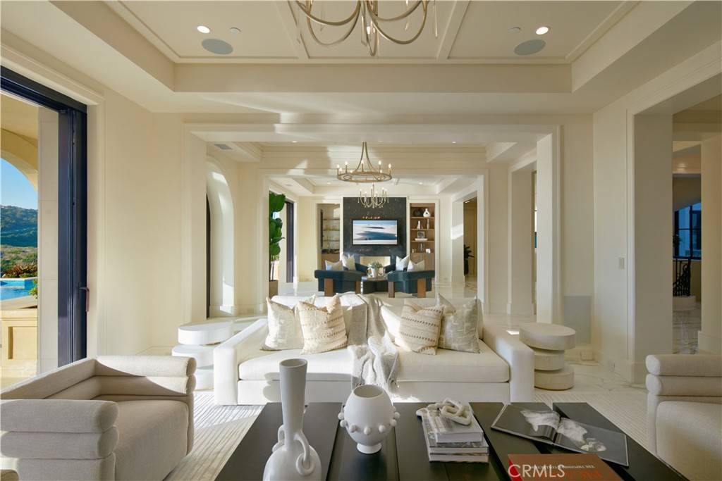 3 Del Mar Home in Newport Beach, California. Nestled behind double gates in the esteemed Estate Collection at Crystal Cove, this brand-new custom home (completed in 2023) graces one of Newport Coast's most coveted streets. Drawing inspiration from classic northern Italian villas, this grand residence offers breathtaking vistas of the Pacific Ocean, Pelican Hill Golf Course, Newport Harbor, verdant canyons, and stunning sunsets. 