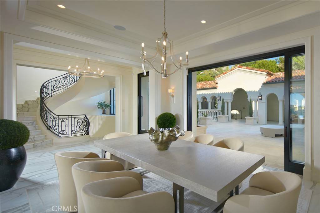 3 Del Mar Home in Newport Beach, California. Nestled behind double gates in the esteemed Estate Collection at Crystal Cove, this brand-new custom home (completed in 2023) graces one of Newport Coast's most coveted streets. Drawing inspiration from classic northern Italian villas, this grand residence offers breathtaking vistas of the Pacific Ocean, Pelican Hill Golf Course, Newport Harbor, verdant canyons, and stunning sunsets. 