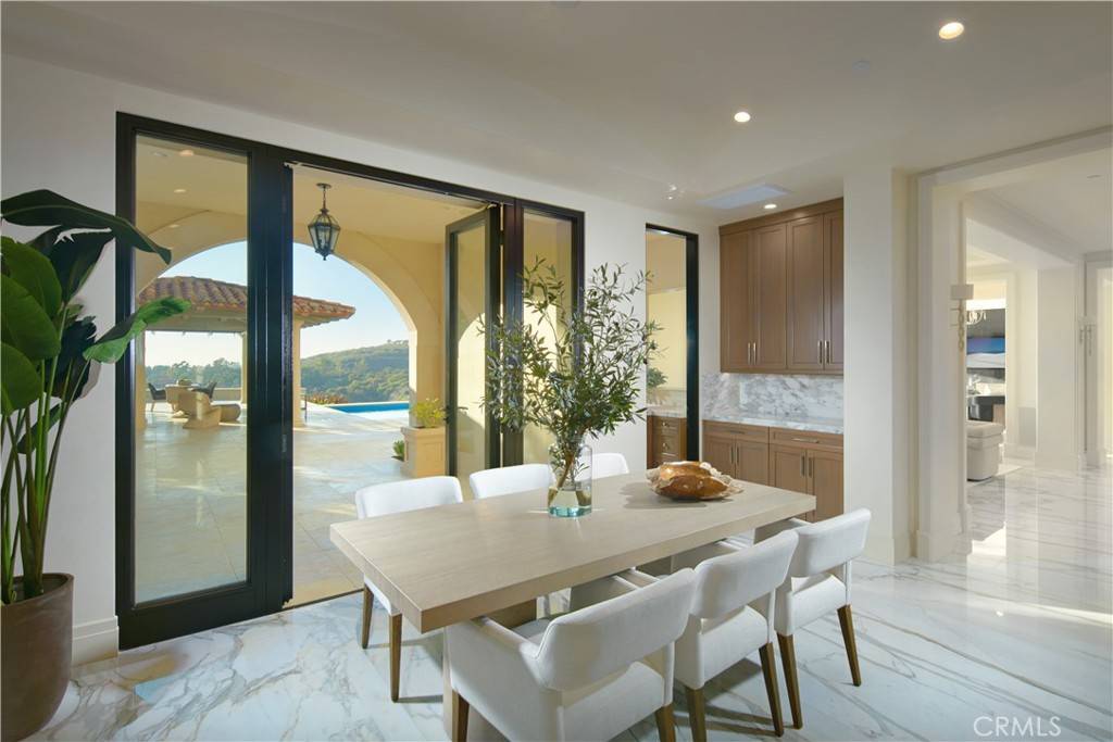 3 Del Mar Home in Newport Beach, California. Nestled behind double gates in the esteemed Estate Collection at Crystal Cove, this brand-new custom home (completed in 2023) graces one of Newport Coast's most coveted streets. Drawing inspiration from classic northern Italian villas, this grand residence offers breathtaking vistas of the Pacific Ocean, Pelican Hill Golf Course, Newport Harbor, verdant canyons, and stunning sunsets. 