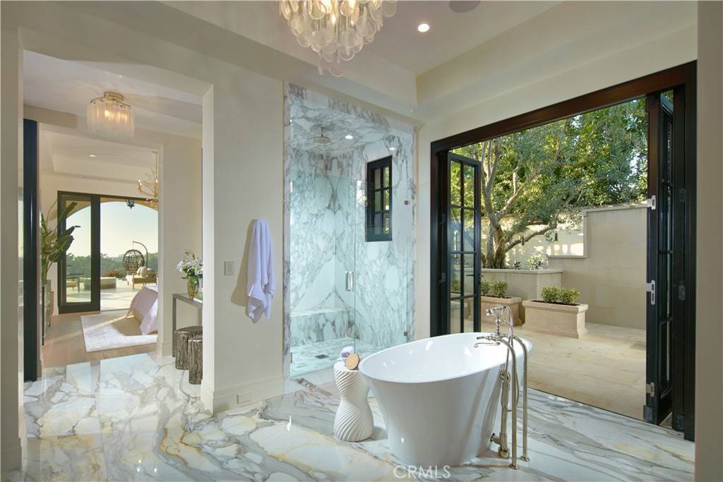 3 Del Mar Home in Newport Beach, California. Nestled behind double gates in the esteemed Estate Collection at Crystal Cove, this brand-new custom home (completed in 2023) graces one of Newport Coast's most coveted streets. Drawing inspiration from classic northern Italian villas, this grand residence offers breathtaking vistas of the Pacific Ocean, Pelican Hill Golf Course, Newport Harbor, verdant canyons, and stunning sunsets. 