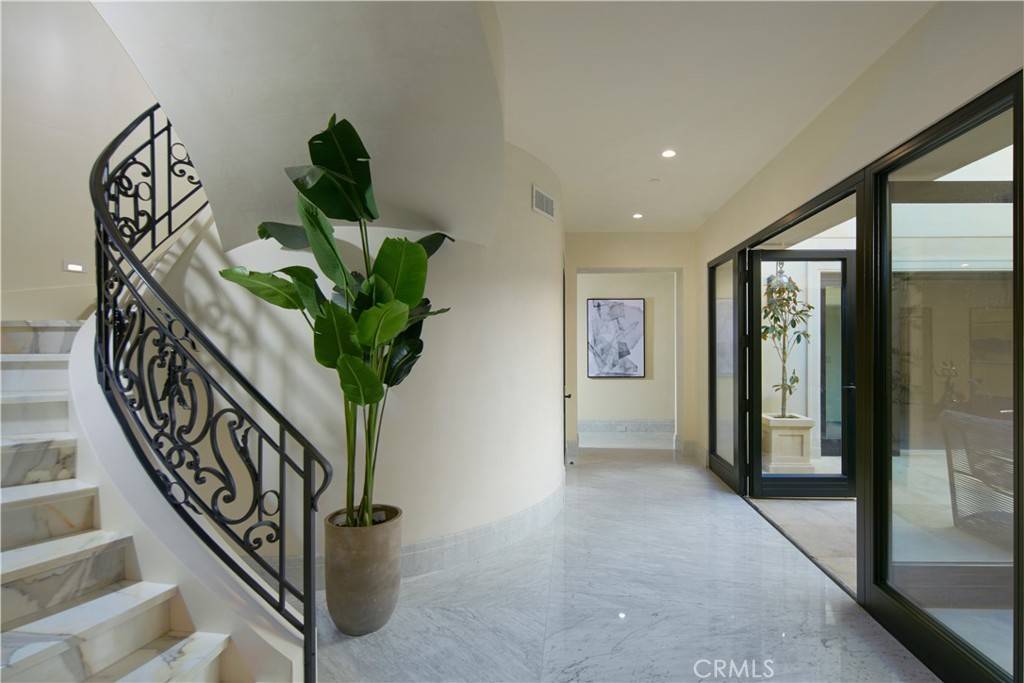 3 Del Mar Home in Newport Beach, California. Nestled behind double gates in the esteemed Estate Collection at Crystal Cove, this brand-new custom home (completed in 2023) graces one of Newport Coast's most coveted streets. Drawing inspiration from classic northern Italian villas, this grand residence offers breathtaking vistas of the Pacific Ocean, Pelican Hill Golf Course, Newport Harbor, verdant canyons, and stunning sunsets. 