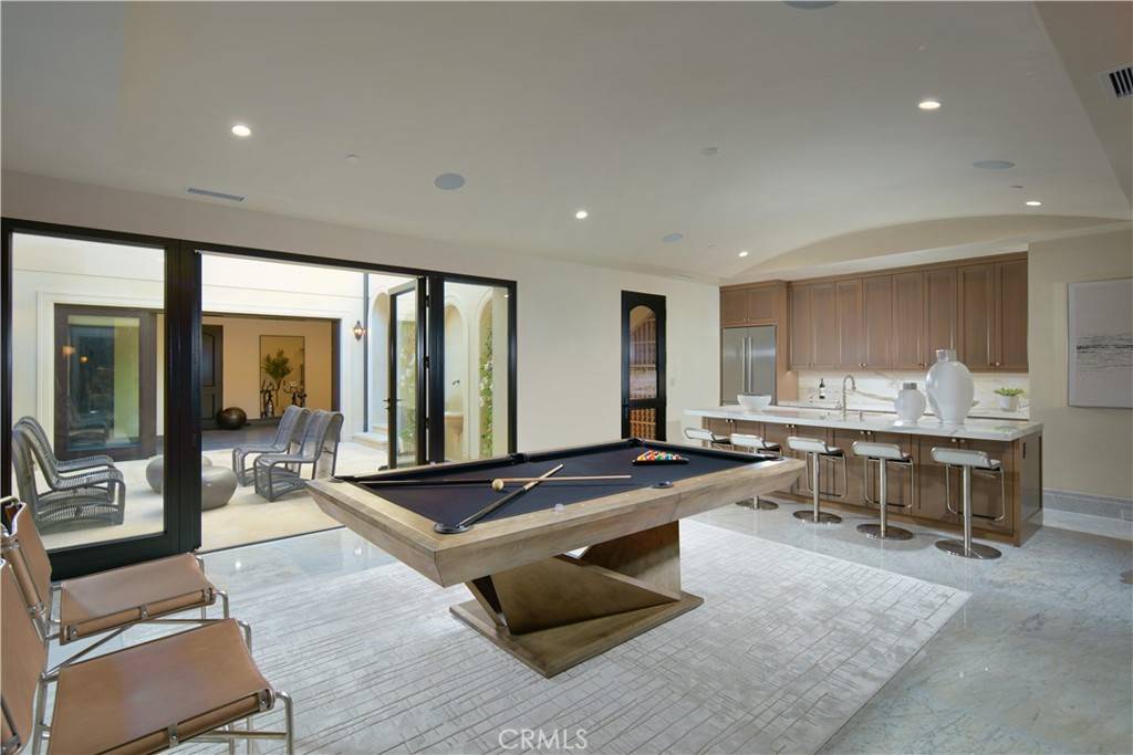 3 Del Mar Home in Newport Beach, California. Nestled behind double gates in the esteemed Estate Collection at Crystal Cove, this brand-new custom home (completed in 2023) graces one of Newport Coast's most coveted streets. Drawing inspiration from classic northern Italian villas, this grand residence offers breathtaking vistas of the Pacific Ocean, Pelican Hill Golf Course, Newport Harbor, verdant canyons, and stunning sunsets. 
