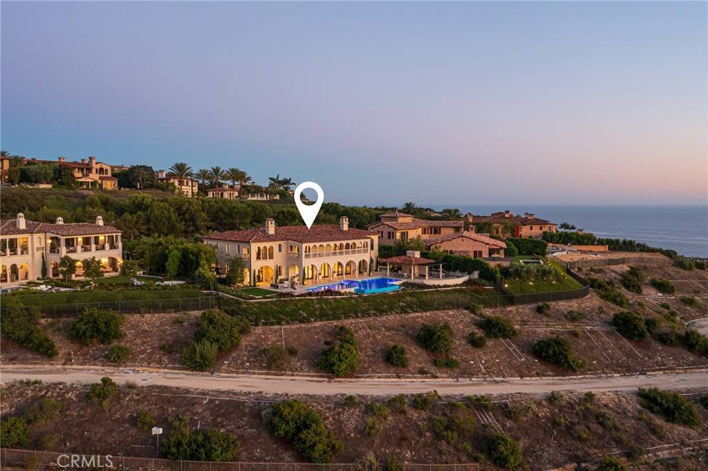 3 Del Mar Home in Newport Beach, California. Nestled behind double gates in the esteemed Estate Collection at Crystal Cove, this brand-new custom home (completed in 2023) graces one of Newport Coast's most coveted streets. Drawing inspiration from classic northern Italian villas, this grand residence offers breathtaking vistas of the Pacific Ocean, Pelican Hill Golf Course, Newport Harbor, verdant canyons, and stunning sunsets. 