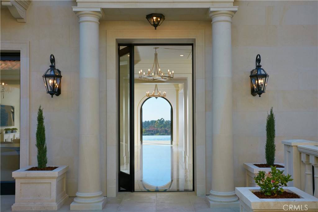 3 Del Mar Home in Newport Beach, California. Nestled behind double gates in the esteemed Estate Collection at Crystal Cove, this brand-new custom home (completed in 2023) graces one of Newport Coast's most coveted streets. Drawing inspiration from classic northern Italian villas, this grand residence offers breathtaking vistas of the Pacific Ocean, Pelican Hill Golf Course, Newport Harbor, verdant canyons, and stunning sunsets. 