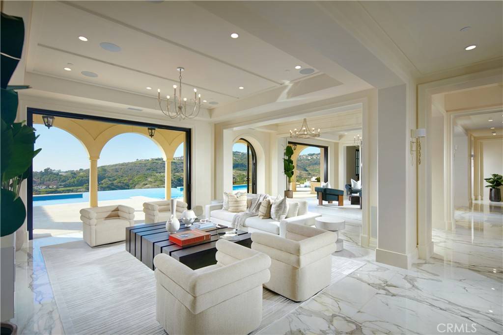 3 Del Mar Home in Newport Beach, California. Nestled behind double gates in the esteemed Estate Collection at Crystal Cove, this brand-new custom home (completed in 2023) graces one of Newport Coast's most coveted streets. Drawing inspiration from classic northern Italian villas, this grand residence offers breathtaking vistas of the Pacific Ocean, Pelican Hill Golf Course, Newport Harbor, verdant canyons, and stunning sunsets. 