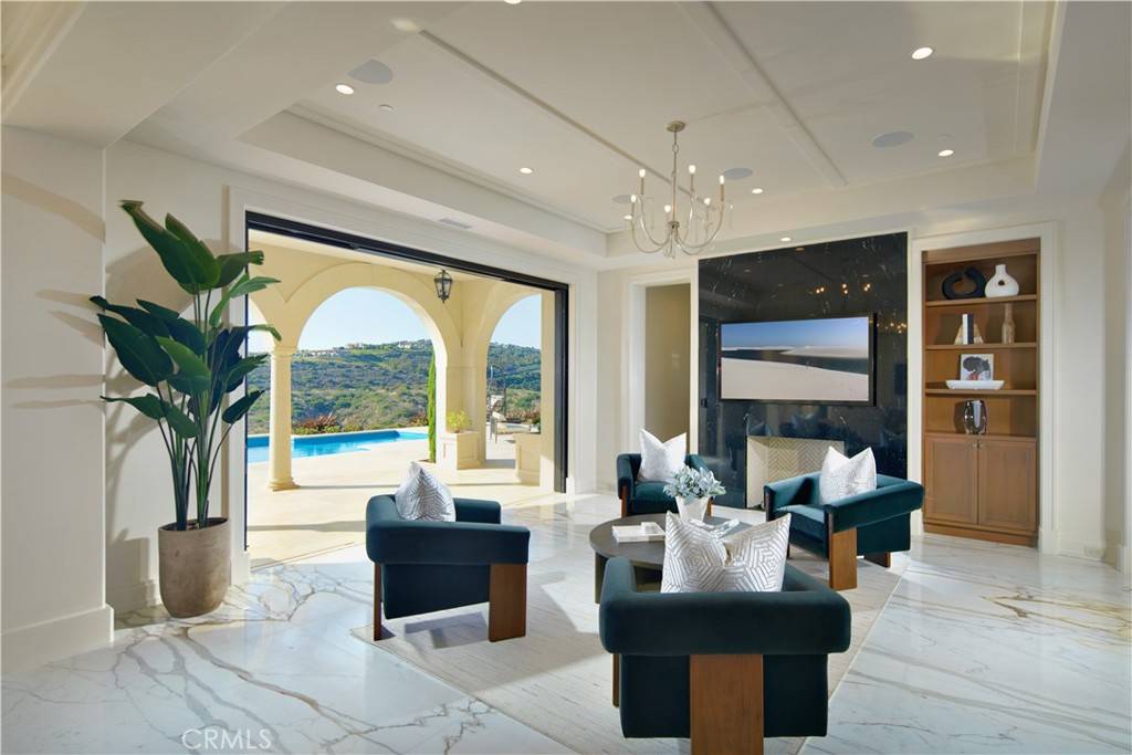 3 Del Mar Home in Newport Beach, California. Nestled behind double gates in the esteemed Estate Collection at Crystal Cove, this brand-new custom home (completed in 2023) graces one of Newport Coast's most coveted streets. Drawing inspiration from classic northern Italian villas, this grand residence offers breathtaking vistas of the Pacific Ocean, Pelican Hill Golf Course, Newport Harbor, verdant canyons, and stunning sunsets. 