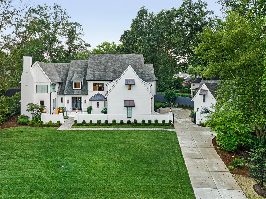 4000 Columbine Circle Home in Charlotte, North Carolina. Discover exquisite luxury living in this custom 5-bedroom, 5.5-bathroom home located in the desirable Foxcroft neighborhood. This David DuBose-designed residence features a gourmet kitchen, light-filled rooms with floor-to-ceiling windows, a spacious primary suite with a large closet, and a beautiful outdoor living space with a pool, spa, and detached garage with a flex space above.