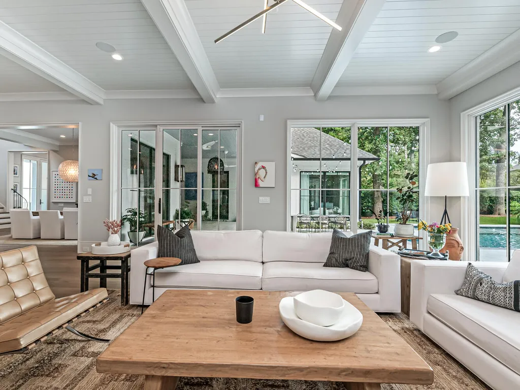 4000 Columbine Circle Home in Charlotte, North Carolina. Discover exquisite luxury living in this custom 5-bedroom, 5.5-bathroom home located in the desirable Foxcroft neighborhood. This David DuBose-designed residence features a gourmet kitchen, light-filled rooms with floor-to-ceiling windows, a spacious primary suite with a large closet, and a beautiful outdoor living space with a pool, spa, and detached garage with a flex space above.