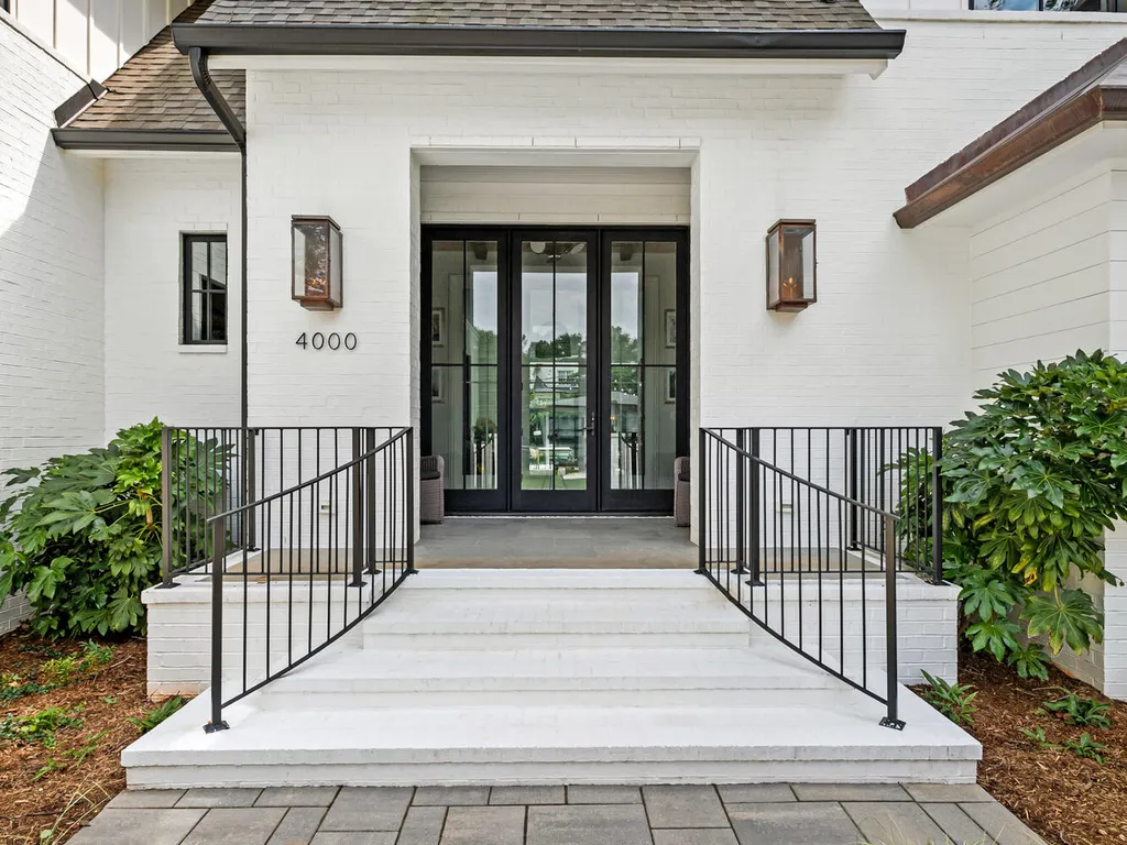 4000 Columbine Circle Home in Charlotte, North Carolina. Discover exquisite luxury living in this custom 5-bedroom, 5.5-bathroom home located in the desirable Foxcroft neighborhood. This David DuBose-designed residence features a gourmet kitchen, light-filled rooms with floor-to-ceiling windows, a spacious primary suite with a large closet, and a beautiful outdoor living space with a pool, spa, and detached garage with a flex space above.