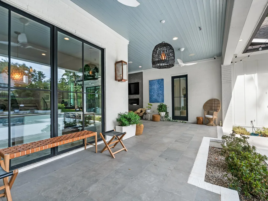 4000 Columbine Circle Home in Charlotte, North Carolina. Discover exquisite luxury living in this custom 5-bedroom, 5.5-bathroom home located in the desirable Foxcroft neighborhood. This David DuBose-designed residence features a gourmet kitchen, light-filled rooms with floor-to-ceiling windows, a spacious primary suite with a large closet, and a beautiful outdoor living space with a pool, spa, and detached garage with a flex space above.