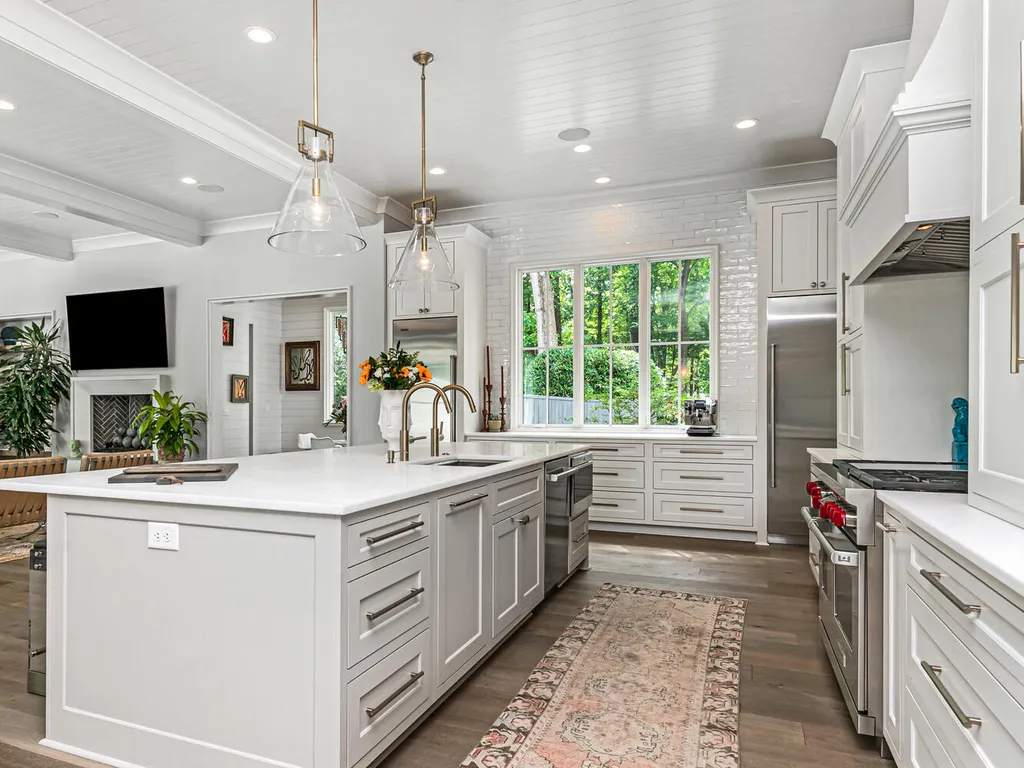 4000 Columbine Circle Home in Charlotte, North Carolina. Discover exquisite luxury living in this custom 5-bedroom, 5.5-bathroom home located in the desirable Foxcroft neighborhood. This David DuBose-designed residence features a gourmet kitchen, light-filled rooms with floor-to-ceiling windows, a spacious primary suite with a large closet, and a beautiful outdoor living space with a pool, spa, and detached garage with a flex space above.