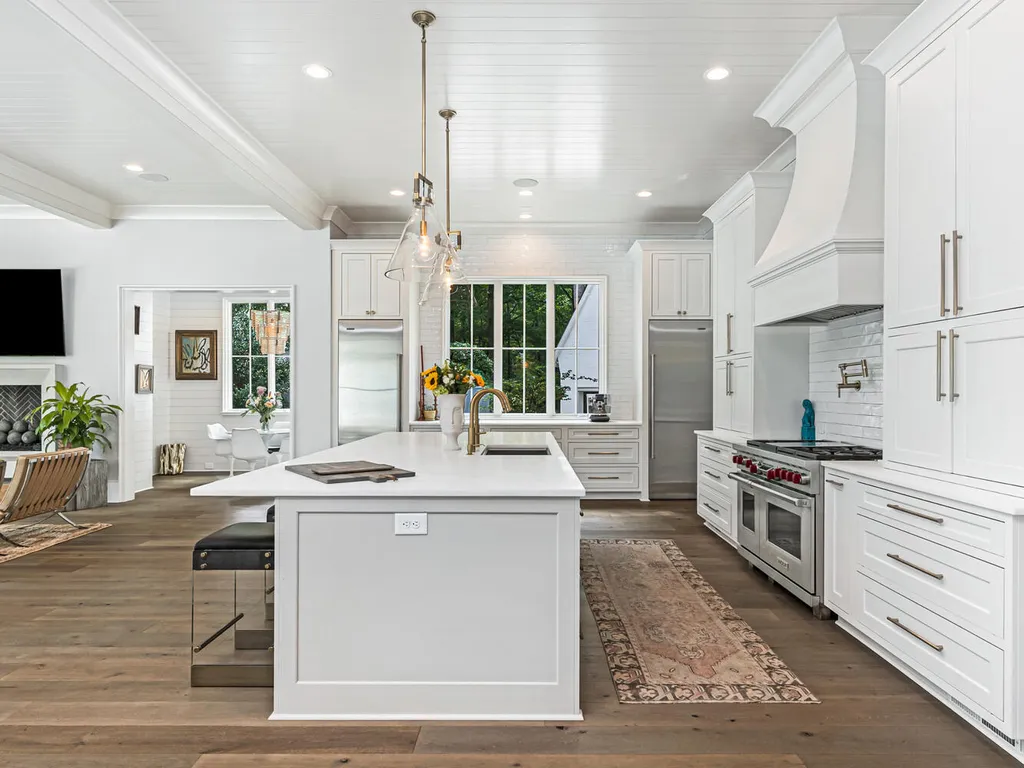 4000 Columbine Circle Home in Charlotte, North Carolina. Discover exquisite luxury living in this custom 5-bedroom, 5.5-bathroom home located in the desirable Foxcroft neighborhood. This David DuBose-designed residence features a gourmet kitchen, light-filled rooms with floor-to-ceiling windows, a spacious primary suite with a large closet, and a beautiful outdoor living space with a pool, spa, and detached garage with a flex space above.