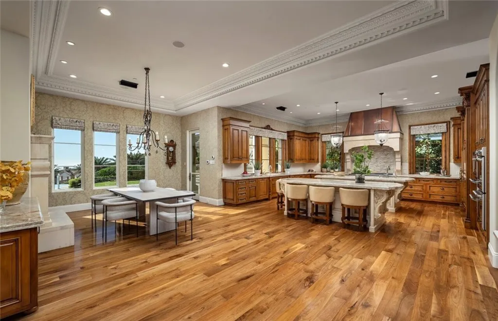5 Pelicans Drive Home in Newport Coast, California. This stunning Pelican Crest estate is ideally located on one of the most coveted prime view lots in the community. It offers luxury and elegance along with warm and inviting living. The property has 6 bedrooms, 6.5 bathrooms, and a spacious floor plan that is perfect for both intimate living and entertaining. It also features stunning ocean views, a state-of-the-art theater, and a wine cellar.