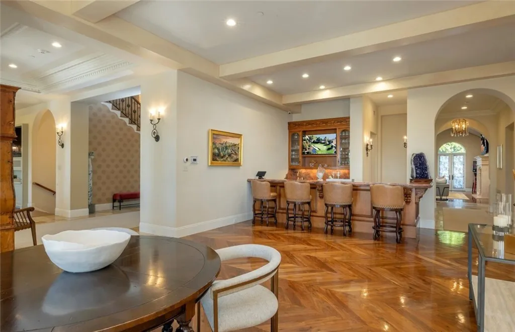 5 Pelicans Drive Home in Newport Coast, California. This stunning Pelican Crest estate is ideally located on one of the most coveted prime view lots in the community. It offers luxury and elegance along with warm and inviting living. The property has 6 bedrooms, 6.5 bathrooms, and a spacious floor plan that is perfect for both intimate living and entertaining. It also features stunning ocean views, a state-of-the-art theater, and a wine cellar.