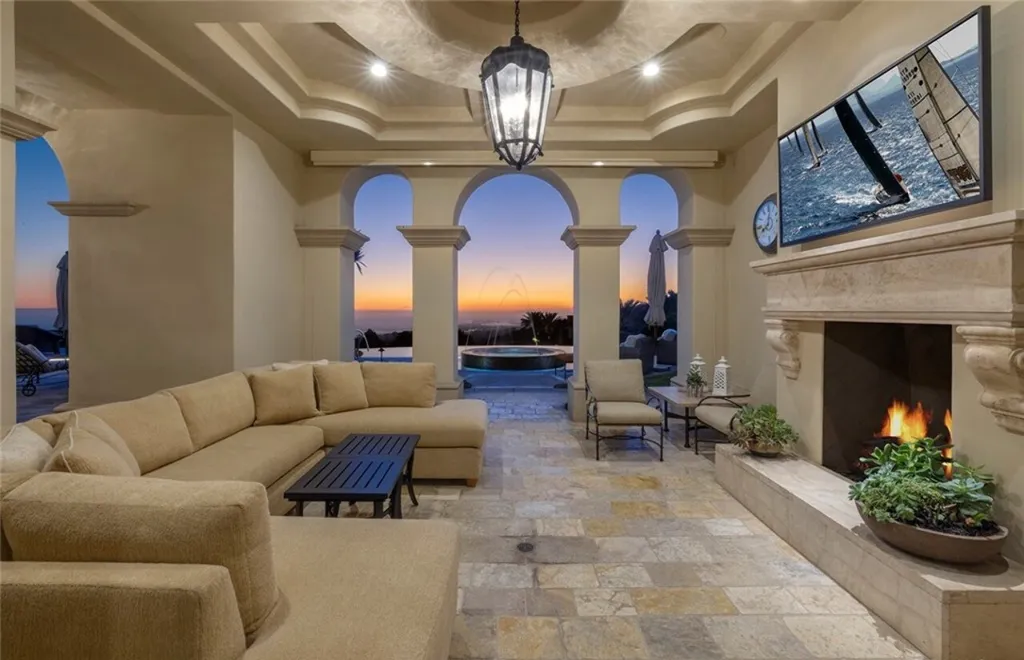 5 Pelicans Drive Home in Newport Coast, California. This stunning Pelican Crest estate is ideally located on one of the most coveted prime view lots in the community. It offers luxury and elegance along with warm and inviting living. The property has 6 bedrooms, 6.5 bathrooms, and a spacious floor plan that is perfect for both intimate living and entertaining. It also features stunning ocean views, a state-of-the-art theater, and a wine cellar.