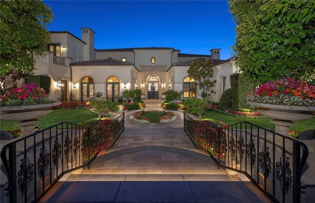 5 Pelicans Drive Home in Newport Coast, California. This stunning Pelican Crest estate is ideally located on one of the most coveted prime view lots in the community. It offers luxury and elegance along with warm and inviting living. The property has 6 bedrooms, 6.5 bathrooms, and a spacious floor plan that is perfect for both intimate living and entertaining. It also features stunning ocean views, a state-of-the-art theater, and a wine cellar.