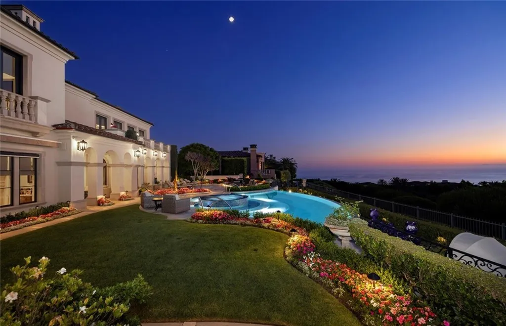 5 Pelicans Drive Home in Newport Coast, California. This stunning Pelican Crest estate is ideally located on one of the most coveted prime view lots in the community. It offers luxury and elegance along with warm and inviting living. The property has 6 bedrooms, 6.5 bathrooms, and a spacious floor plan that is perfect for both intimate living and entertaining. It also features stunning ocean views, a state-of-the-art theater, and a wine cellar.