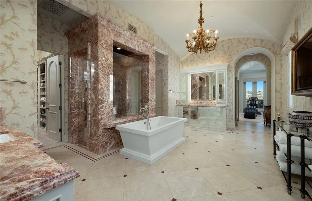 5 Pelicans Drive Home in Newport Coast, California. This stunning Pelican Crest estate is ideally located on one of the most coveted prime view lots in the community. It offers luxury and elegance along with warm and inviting living. The property has 6 bedrooms, 6.5 bathrooms, and a spacious floor plan that is perfect for both intimate living and entertaining. It also features stunning ocean views, a state-of-the-art theater, and a wine cellar.