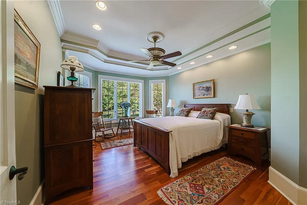 5712 Summit Road Home in Purlear, North Carolina. Explore this exceptional 128+ acre mountain retreat with a gated entrance, a timber-frame home boasting 5 bedrooms and 5 bathrooms. Enjoy the beauty of two spring-fed creeks that encircle the fieldstone exterior of the home.